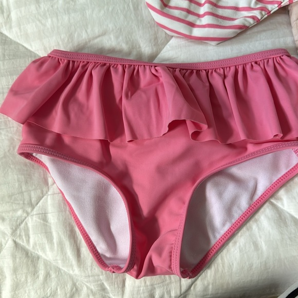 3 bikini bottoms and one bikini and swim shirt. These are all sold as a set - Picture 2 of 5